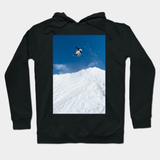 Snowboarder jumping against blue sky Hoodie